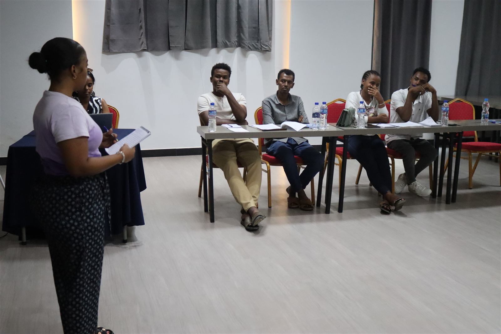 Facilitators seated in a discussion circle